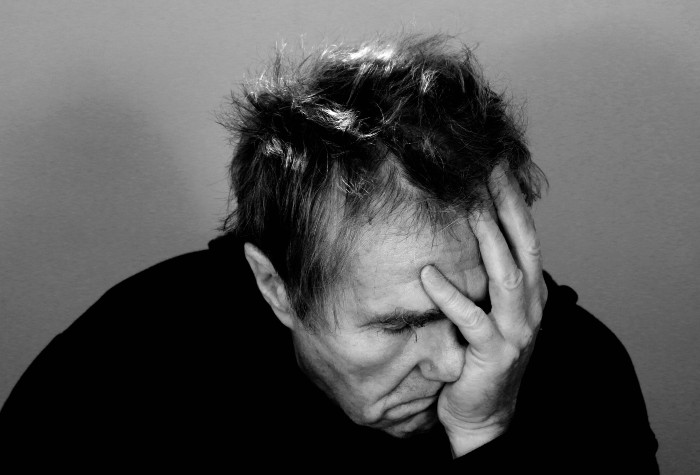 man with chronic headache pain